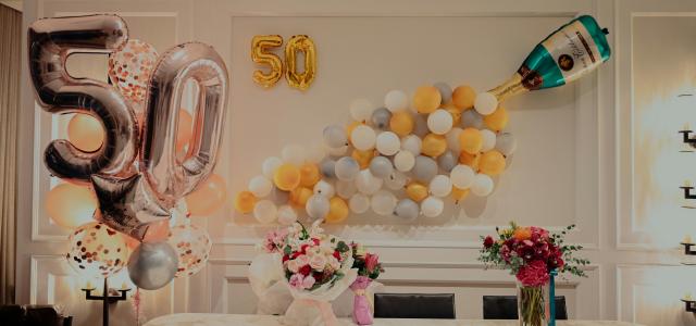 yellow and white balloons on table by Lucas Law courtesy of Unsplash.